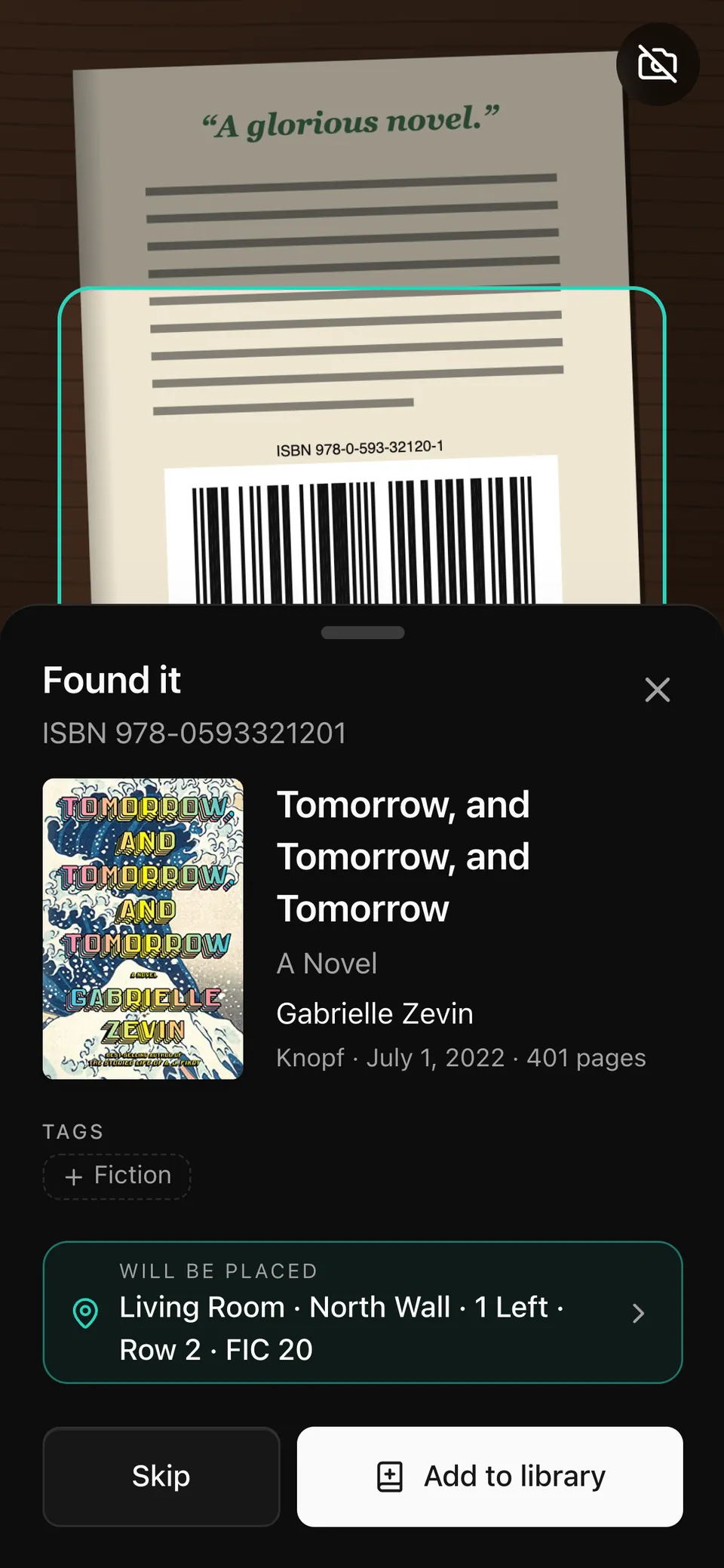 Scanning on a phone: the barcode was read and the book was found, ready to add to the Living Room shelf with label FIC 20.
