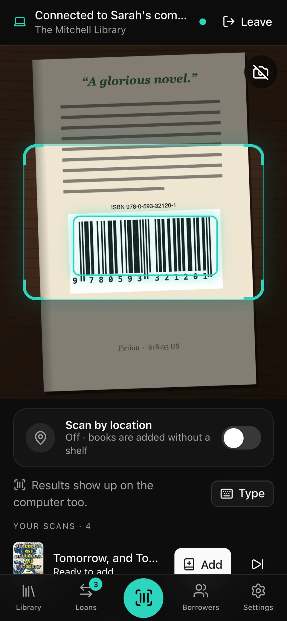 The phone connected to the computer, with a barcode locked in the camera view.