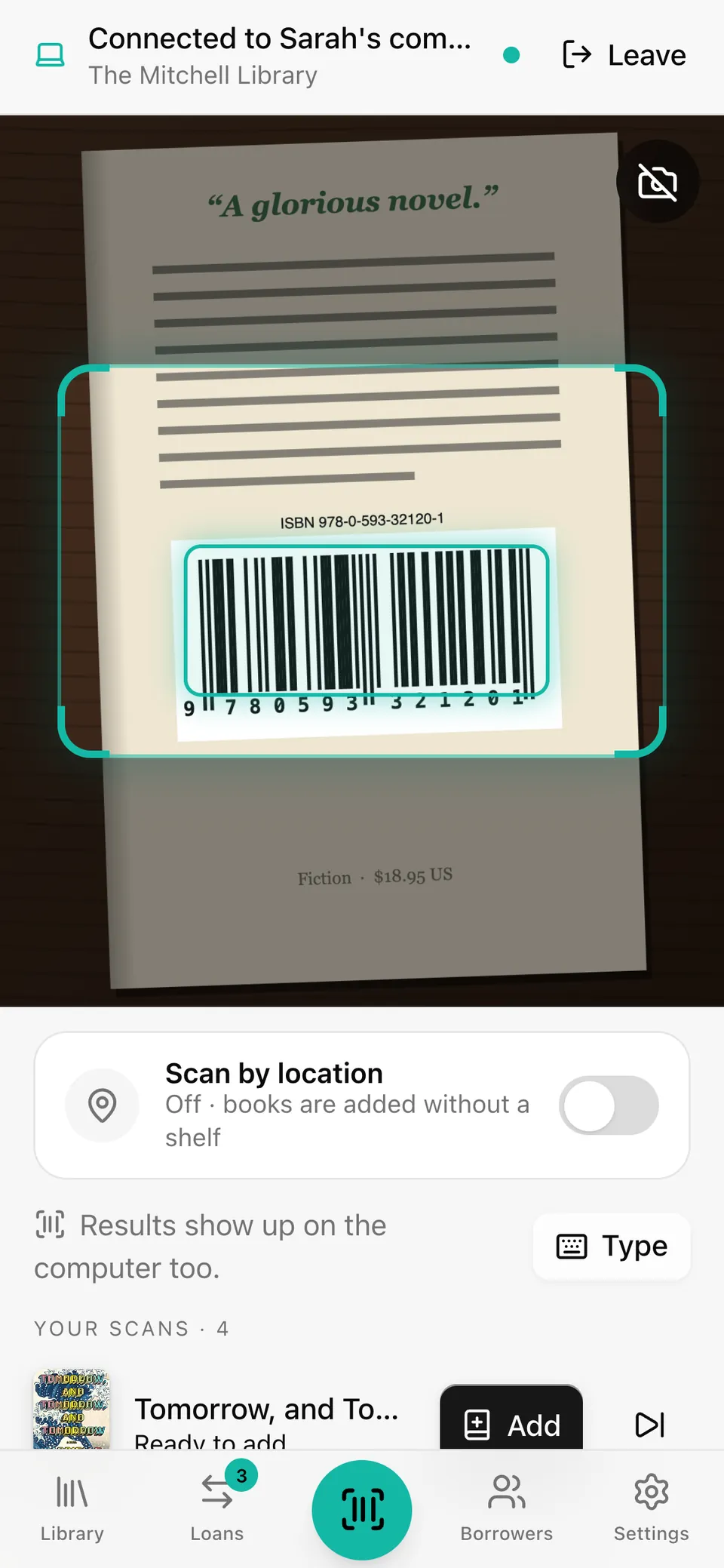 The phone connected to the computer, with a barcode locked in the camera view.